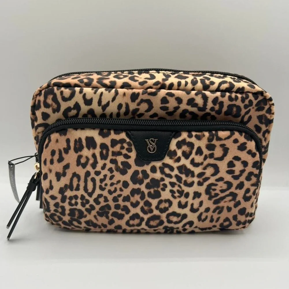 Victoria's Secret Leopard print makeup bag with black stripes interior.